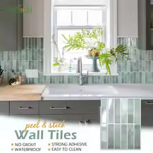 Nutshell DIY Backsplash Tiles peel and stick green glass mosaic behind kitchen sink with faucet and window plants