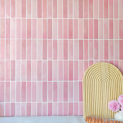 Nutshell pink vertical rectangular DIY Backsplash Tiles with white grout shown with decorative arch board and flowers