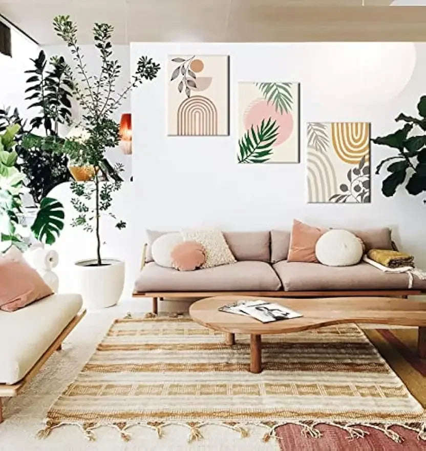 Modern plant canvas wall art set featuring abstract designs on a cozy living room wall