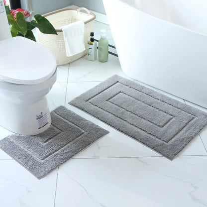 Soft gray plush bathroom floor mat set with contoured shapes for enhanced comfort and style