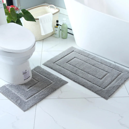 Soft gray plush bathroom floor mat set with contoured shapes for enhanced comfort and style