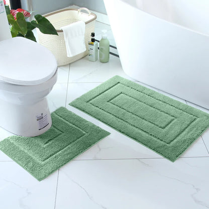 Soft and cozy plush bathroom floor mat set in green, perfect for adding comfort to your bathroom