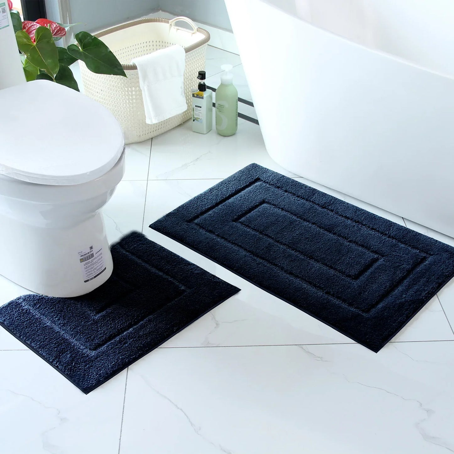 Nutshell plush bathroom floor mat set in dark blue for comfort and style in your bathroom
