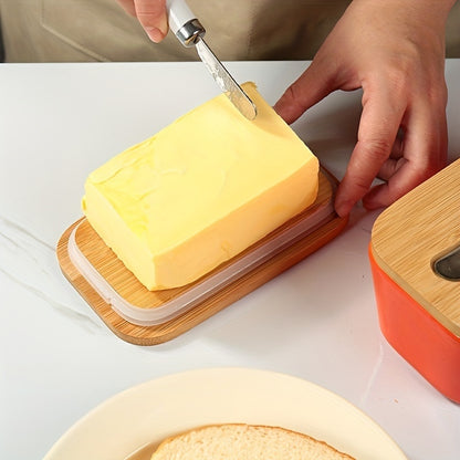 Porcelain butter box with bamboo lid used for spreading butter on fresh bread