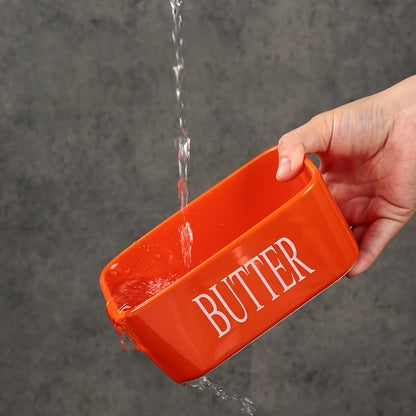 Nutshell porcelain butter box with bamboo lid featuring a vibrant orange design for stylish kitchen storage
