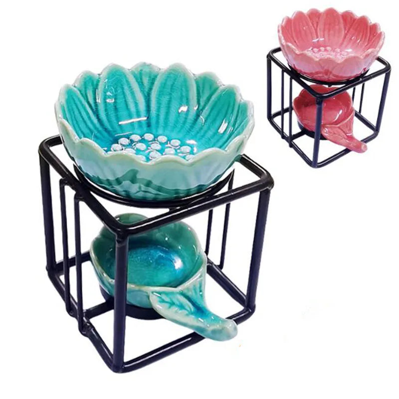 Porcelain lotus essential oil burner by Nutshell in blue and pink colors with black metal stand