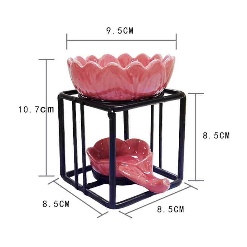 Nutshell porcelain lotus essential oil burner in pink with black metal frame and detailed dimensions