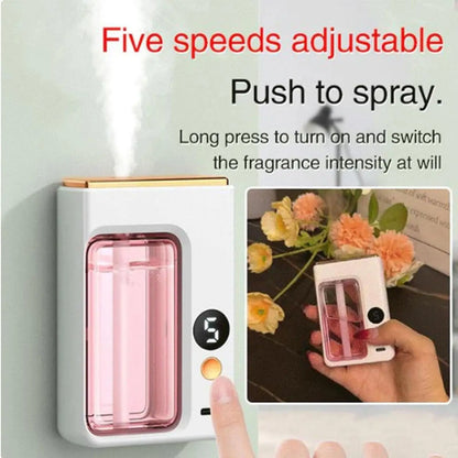 Nutshell portable diffuser with adjustable five-speed spray and pink liquid fragrance inside
