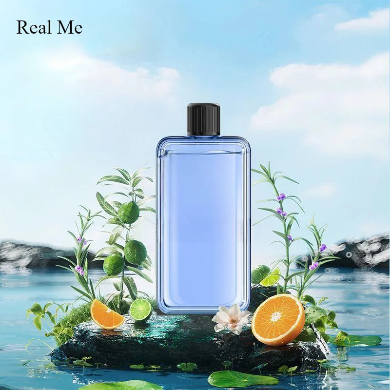 Nutshell portable diffuser with blue liquid surrounded by citrus and greenery on water background
