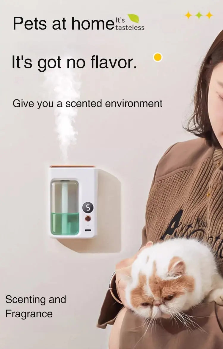 Nutshell portable diffuser emitting mist on a wall with a woman holding a cat beside it