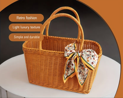 Nutshell rattan picnic basket with a vintage design, durable build, and a decorative scarf bow