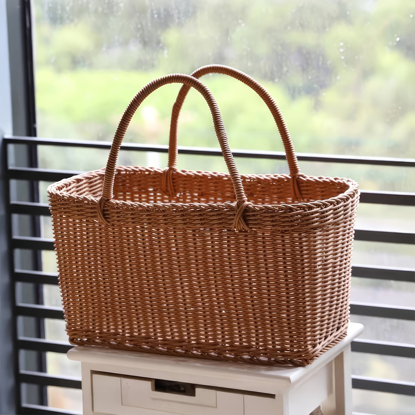 Nutshell rattan picnic basket with sturdy handles perfect for outdoor gatherings