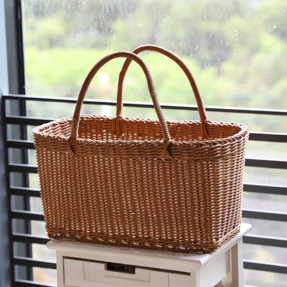 Nutshell rattan picnic basket with sturdy handles perfect for outdoor gatherings