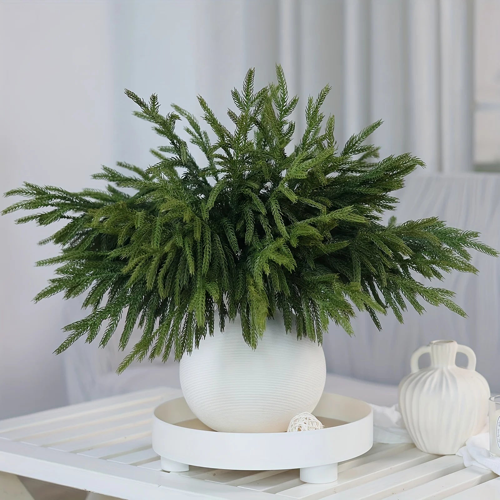 Nutshell real touch faux pine branches arranged in a decorative white vase for home decor