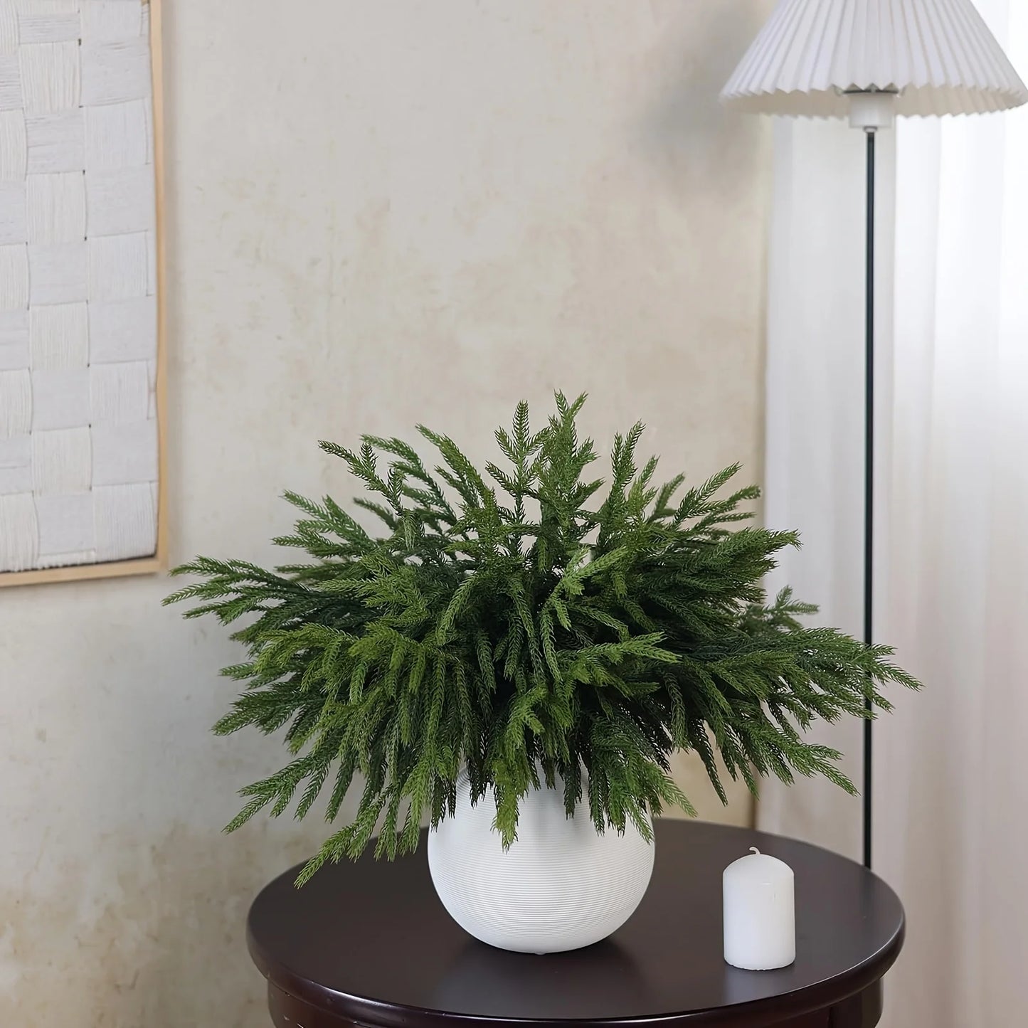 Nutshell real touch faux pine branches in a white pot on a wooden table for elegant home decor