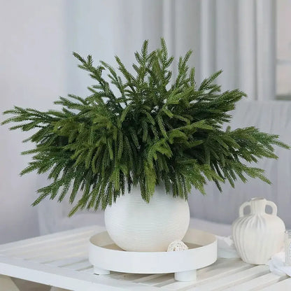 Lifelike arrangement of real touch faux pine branches in a modern white vase for home decor
