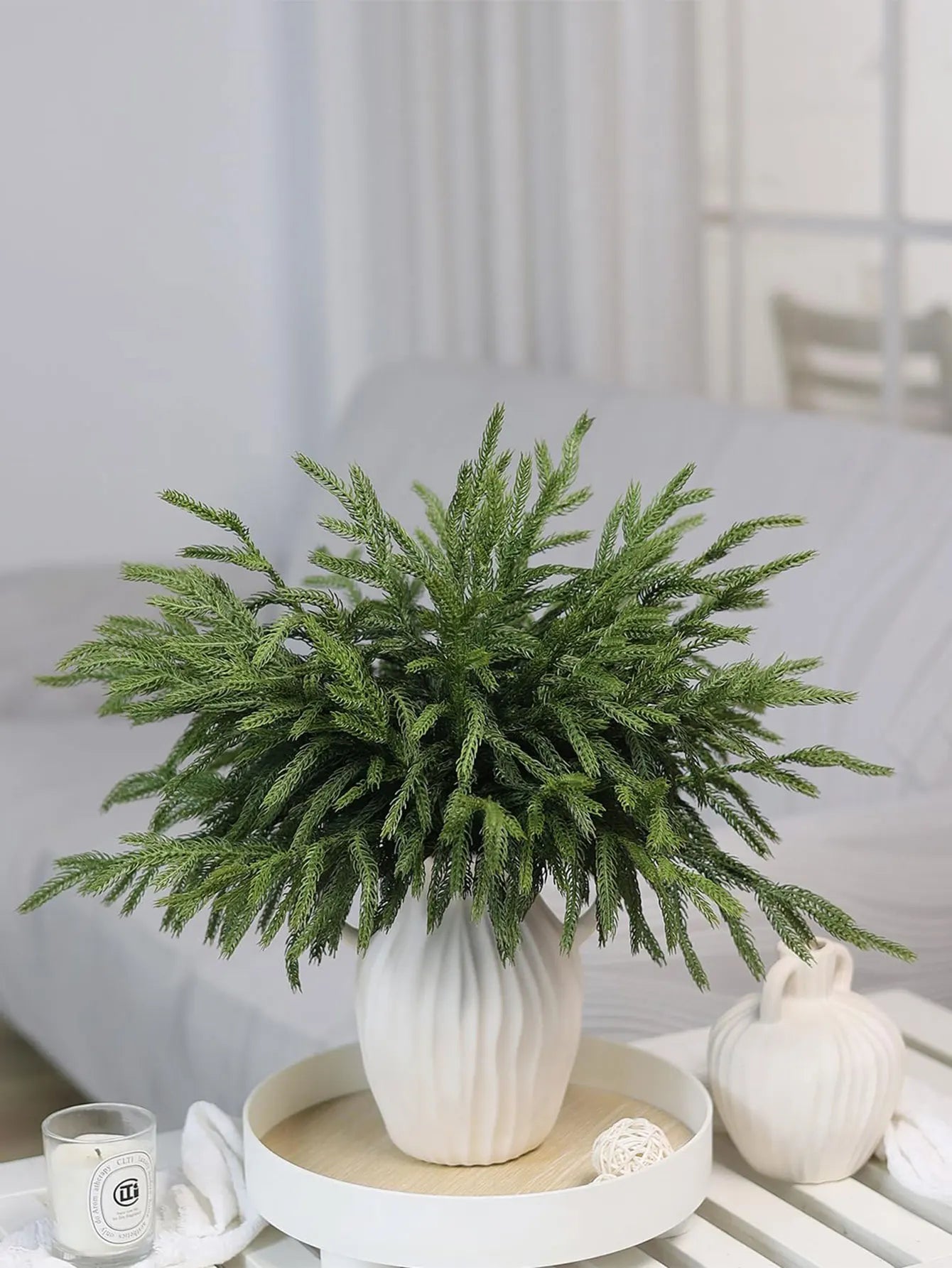 Modern vase with real touch faux pine branches for stylish home decor.