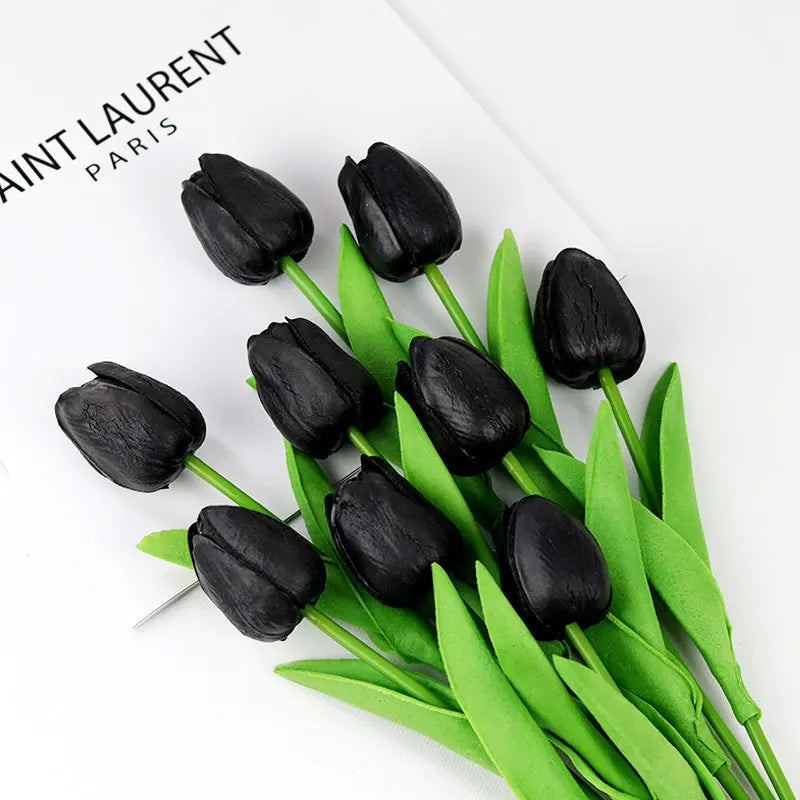 Realistic artificial tulip bouquet in black with vibrant green leaves for home decoration