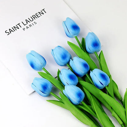 Realistic artificial tulip bouquet in blue with vibrant green leaves for home decor