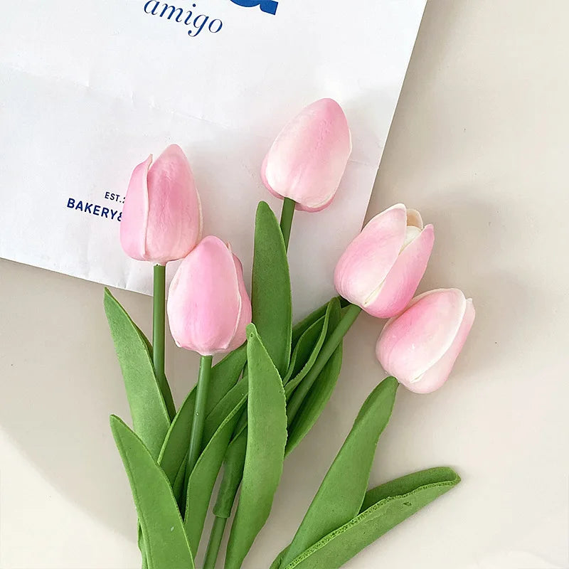 Realistic artificial tulip bouquet in pink with green leaves for home decor