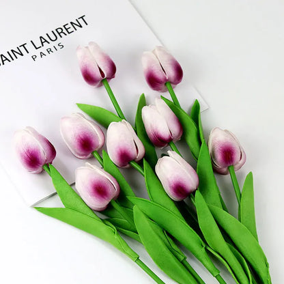 Realistic artificial tulip bouquet with pink and white petals and green leaves for home decor