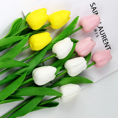 Realistic artificial tulip bouquet featuring pink, yellow, and white tulips with vibrant green leaves