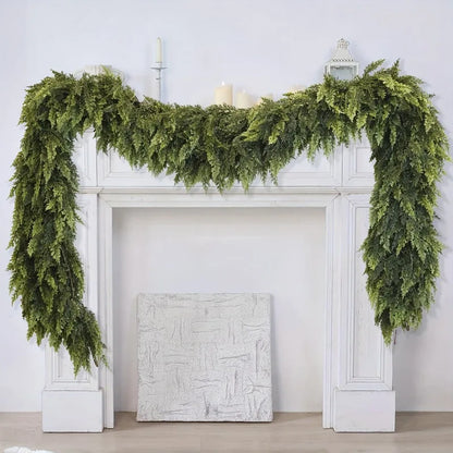 Realistic Christmas Garland draped elegantly over a white fireplace mantel for festive decor