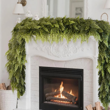 Realistic Christmas Garland draped over a fireplace mantel with a cozy fireplace in the background