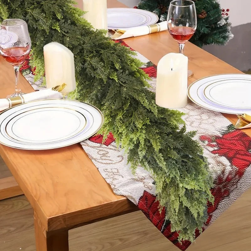 Realistic Christmas Garland beautifully arranged on a holiday dining table setting with candles and glasses