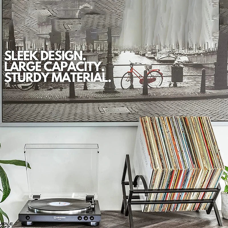 Nutshell Vinyl Record Storage black metal rack holding colorful records beside turntable in modern living room
