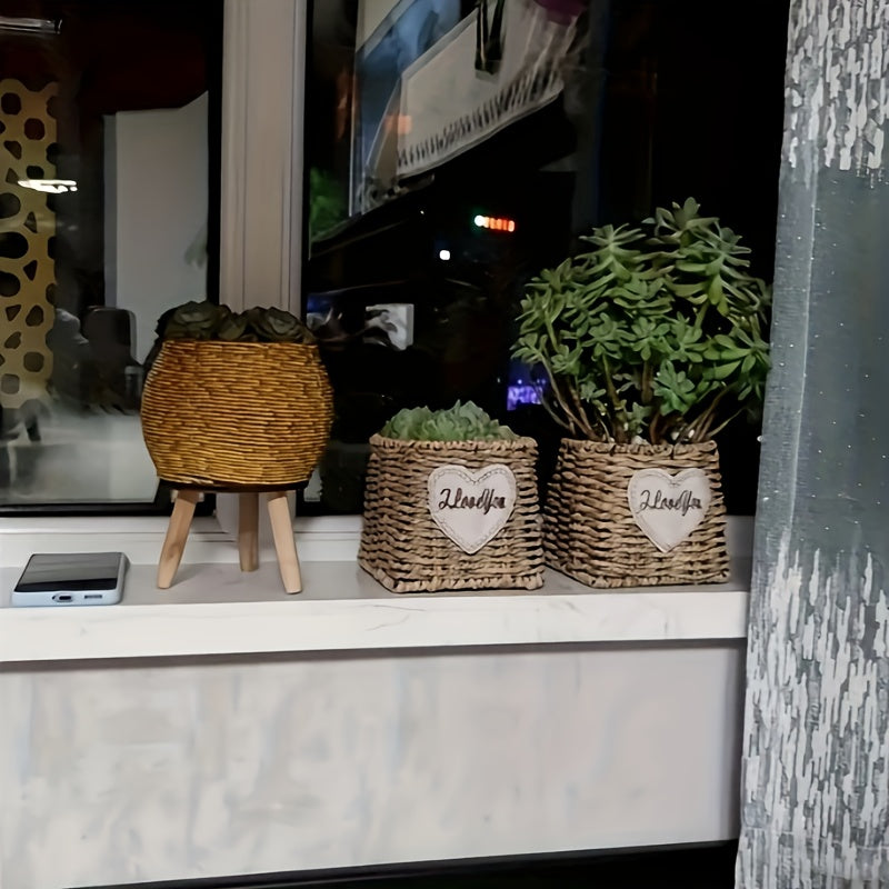 Round flower pot with wooden tripod holding decorative greenery on a windowsill