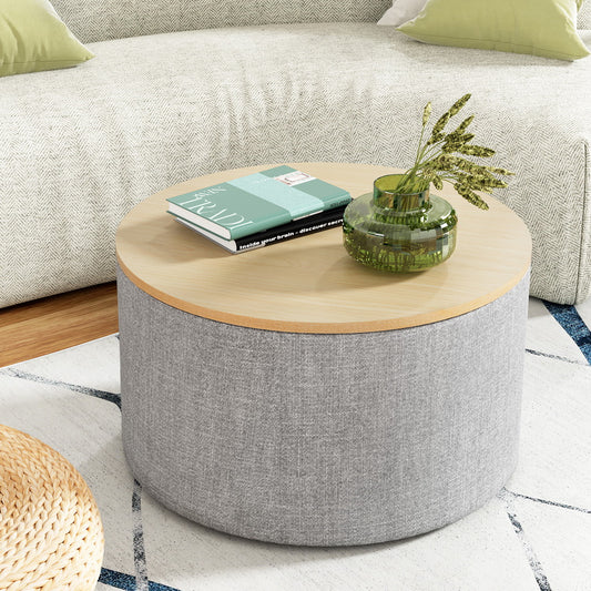 Nutshell round storage ottoman with gray fabric base and wooden top placed in living room