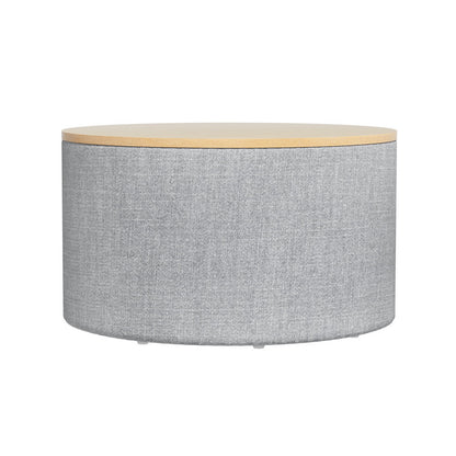 Nutshell round storage ottoman with gray fabric body and wooden top for living room