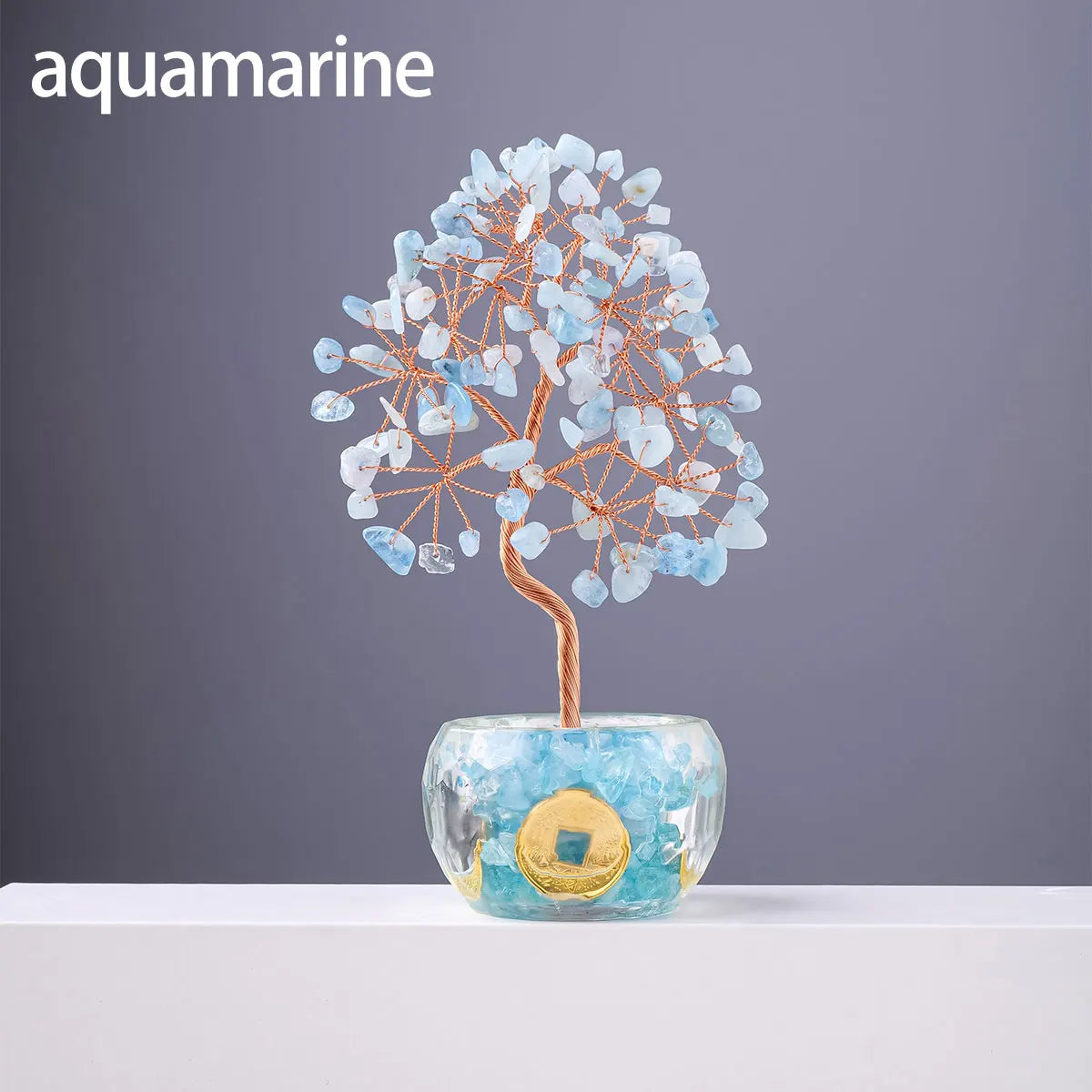 Nutshell aquamarine 7 chakra healing crystal tree with blue stones and gold accents in clear base