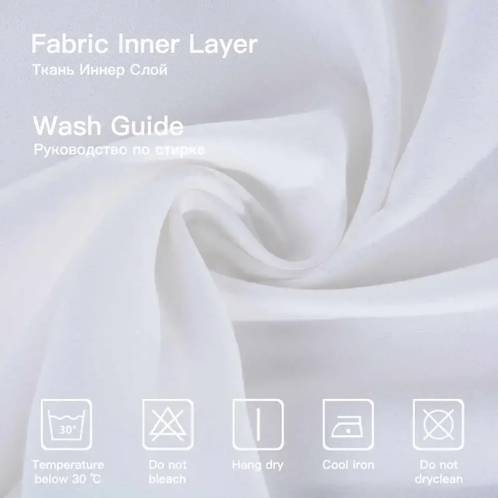 Close-up of fabric inner layer showing texture and wash guide icons for rustic farmhouse pillow cover