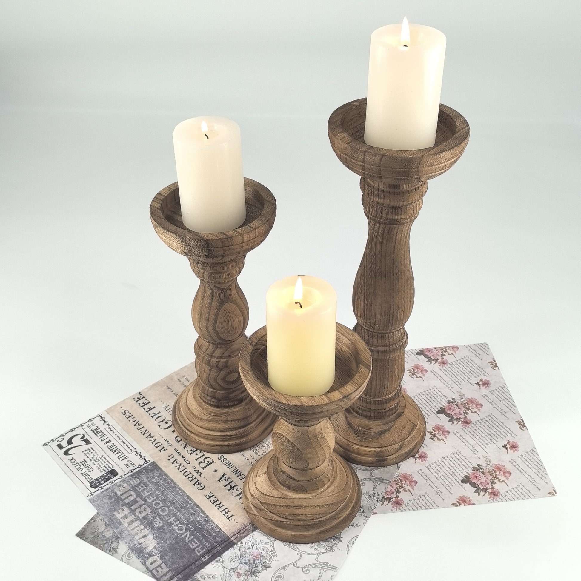 Set of rustic farmhouse wooden candle holders in various heights with candles for elegant decor