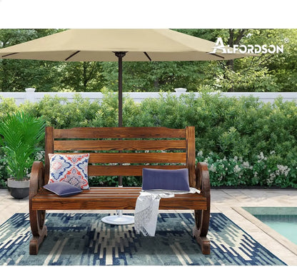 Rustic Garden Bench Wagon Wheel in a peaceful outdoor setting with cushions and an umbrella