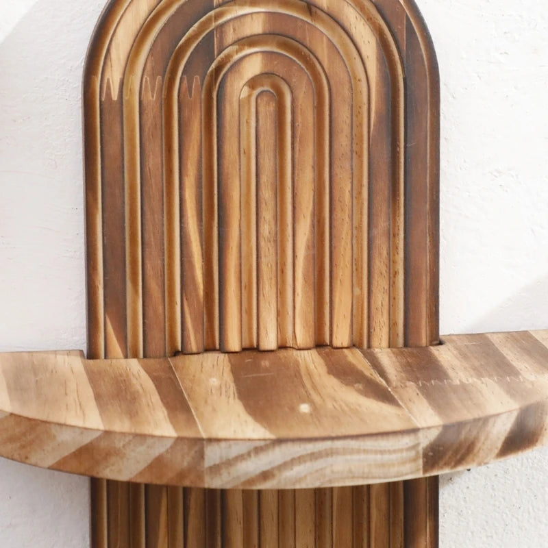 Nutshell wooden wall shelf with curved carved arches and natural wood grain perfect for small decor