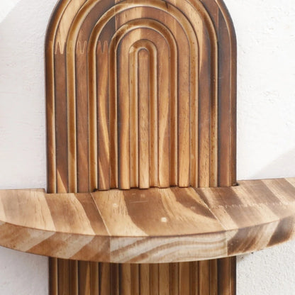 Nutshell wooden wall shelf with curved carved arches and natural wood grain perfect for small decor
