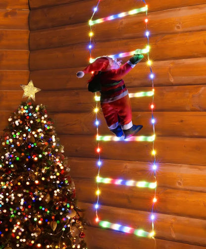 Santa climbing ladder Christmas decoration with colorful lights against a wooden background and Christmas tree