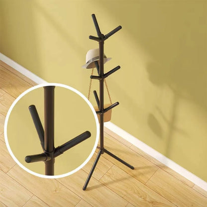 Nutshell black metal tree branch coat rack with tripod base and multiple peg hooks for hats and bags