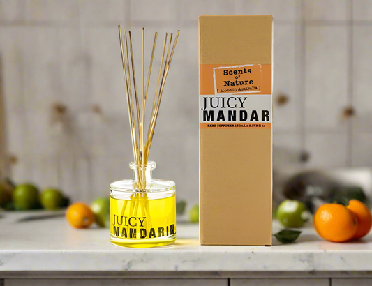 Scents of Nature Reed Diffuser 150mL Juicy Mandarin scent by Nutshell with yellow liquid and natural reeds