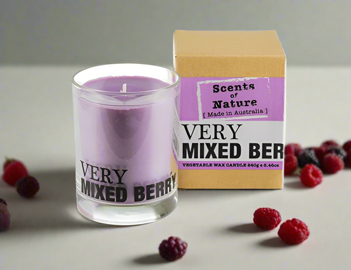 Scents of Nature Soy Candle 240g in Very Mixed Berry scent by Nutshell with brown box and scattered berries