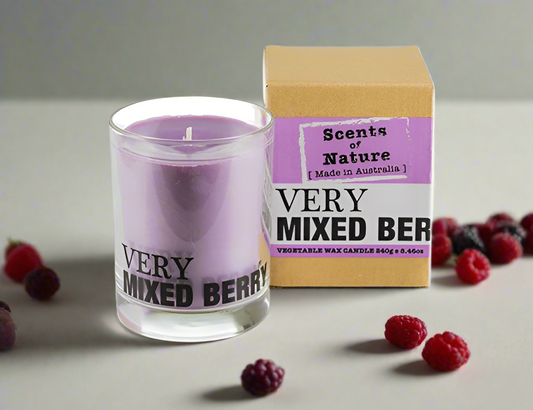 Scents of Nature Soy Candle 240g in Very Mixed Berry scent by Nutshell with brown box and scattered berries