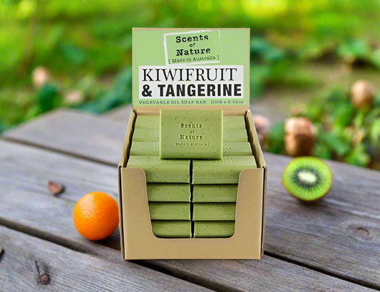 Nutshell Tilley Soap Bars kiwifruit and tangerine scented green soap bars in a cardboard display with fresh kiwi and tangerine