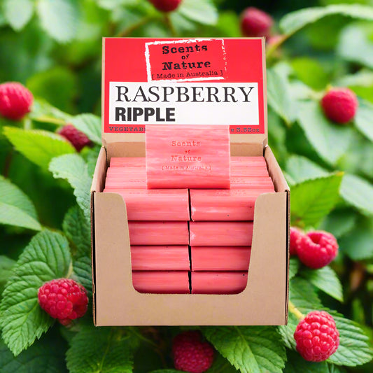 Nutshell Raspberry Ripple soap bars stacked in display box with fresh raspberries backdrop Tilley Soap Bars