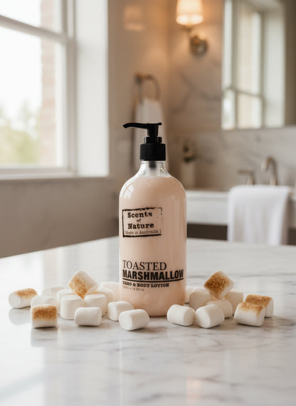 Toasted marshmallow lotion and wash gift set bottle on a marble countertop with mini marshmallows