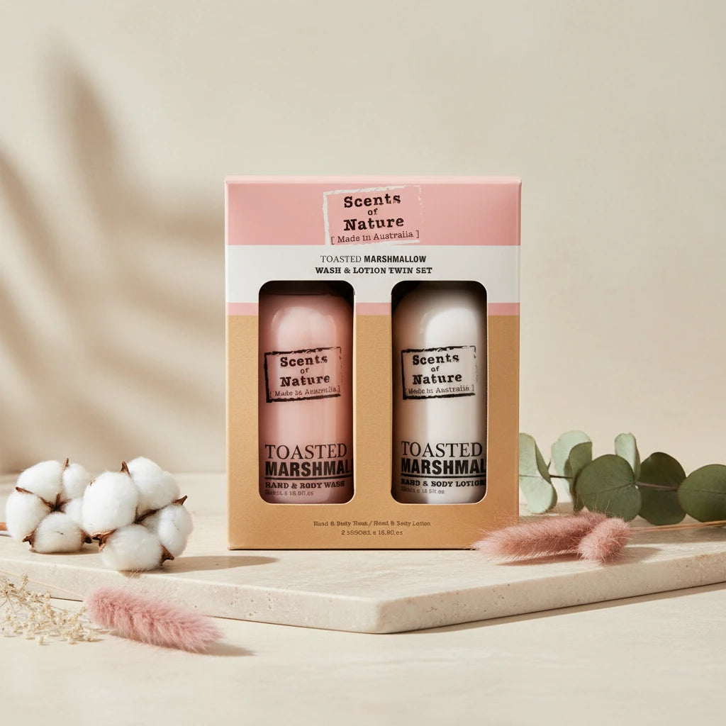 Toasted marshmallow lotion and wash gift set in elegant packaging with cotton and greenery accents