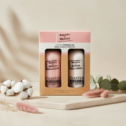 Toasted marshmallow lotion and wash gift set in elegant packaging with cotton and greenery accents
