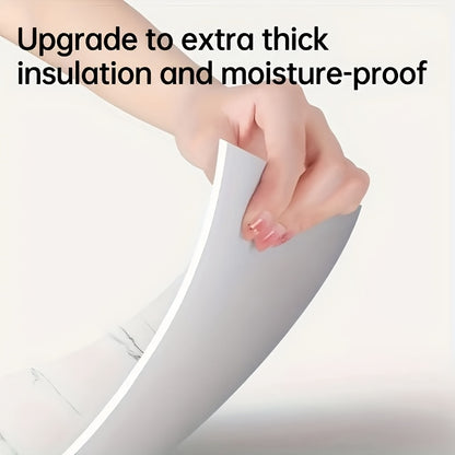 Close-up of a hand demonstrating self-adhesive decorative tiles with extra thick insulation and moisture-proof features